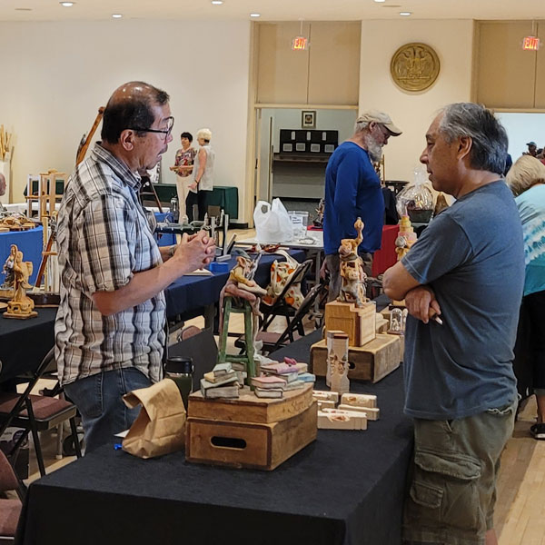 Joe You (left) Presenting Wood Carving at CWA Show 2023